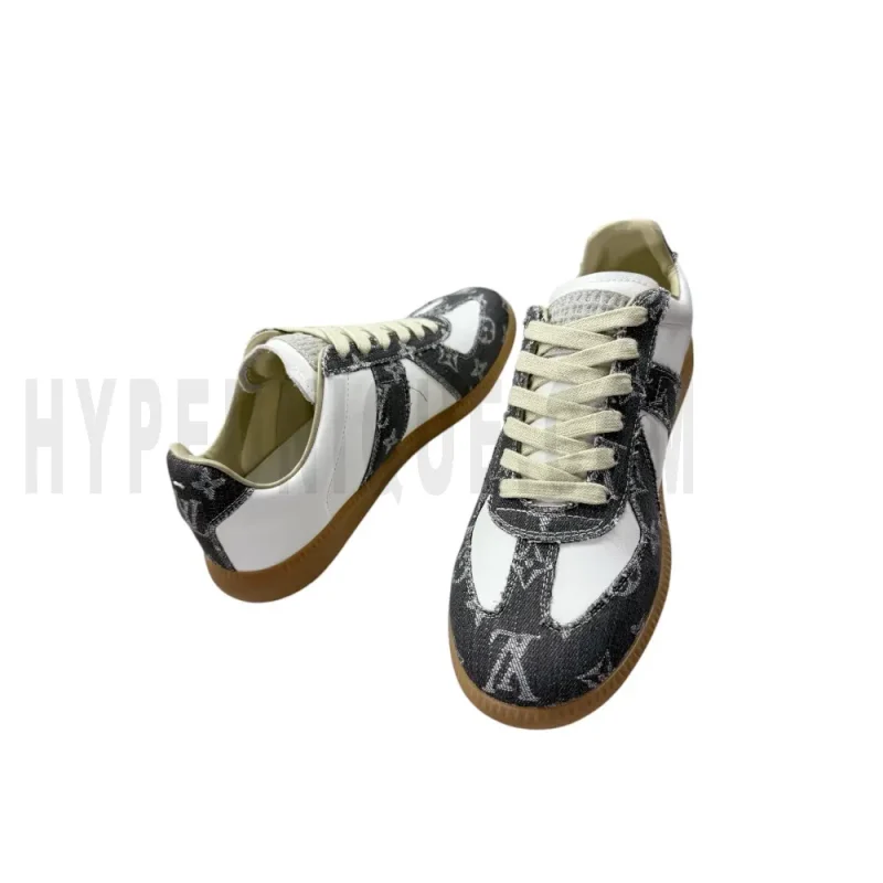 The inside of the white and dark gray shoes