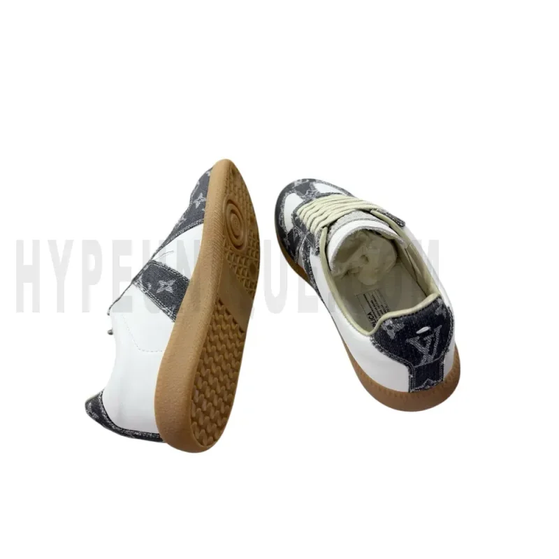 The inside of the white and dark gray shoes