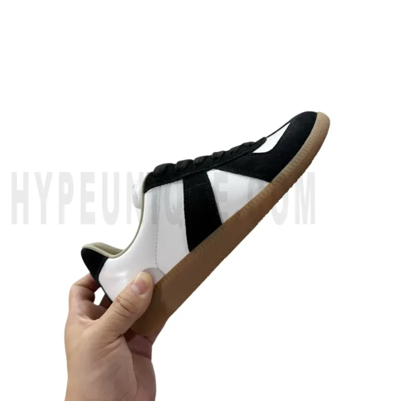 The right side of the white and black shoes