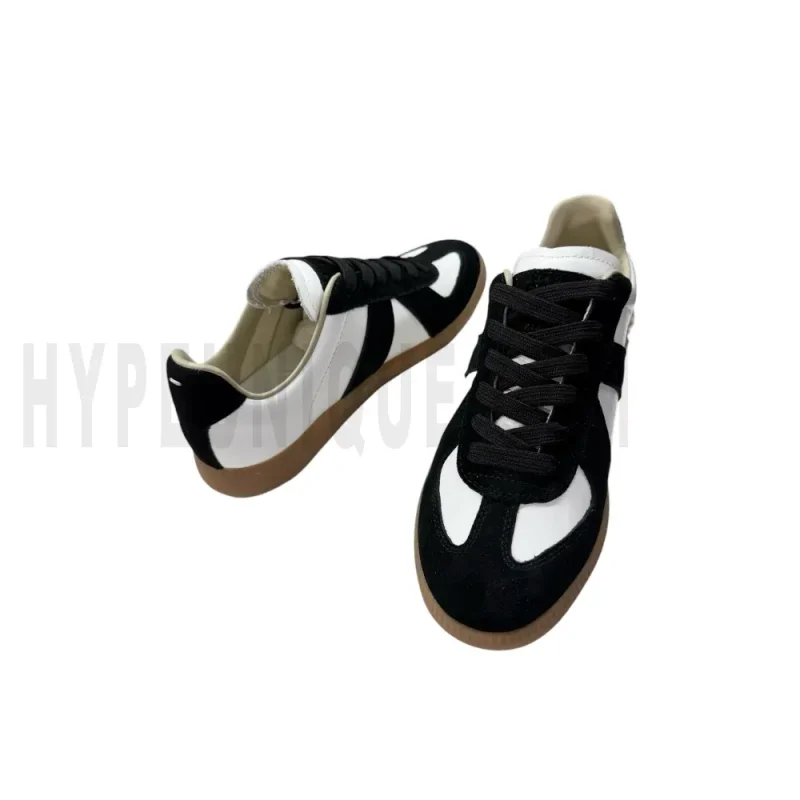 The inside of the white and black shoes