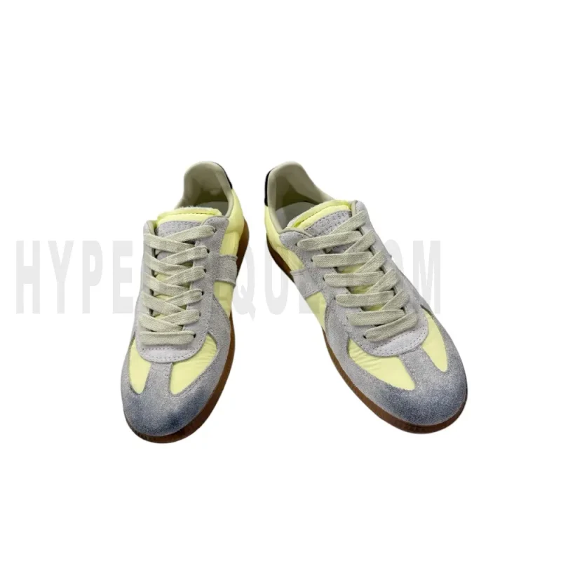 The front of the yellow shoes