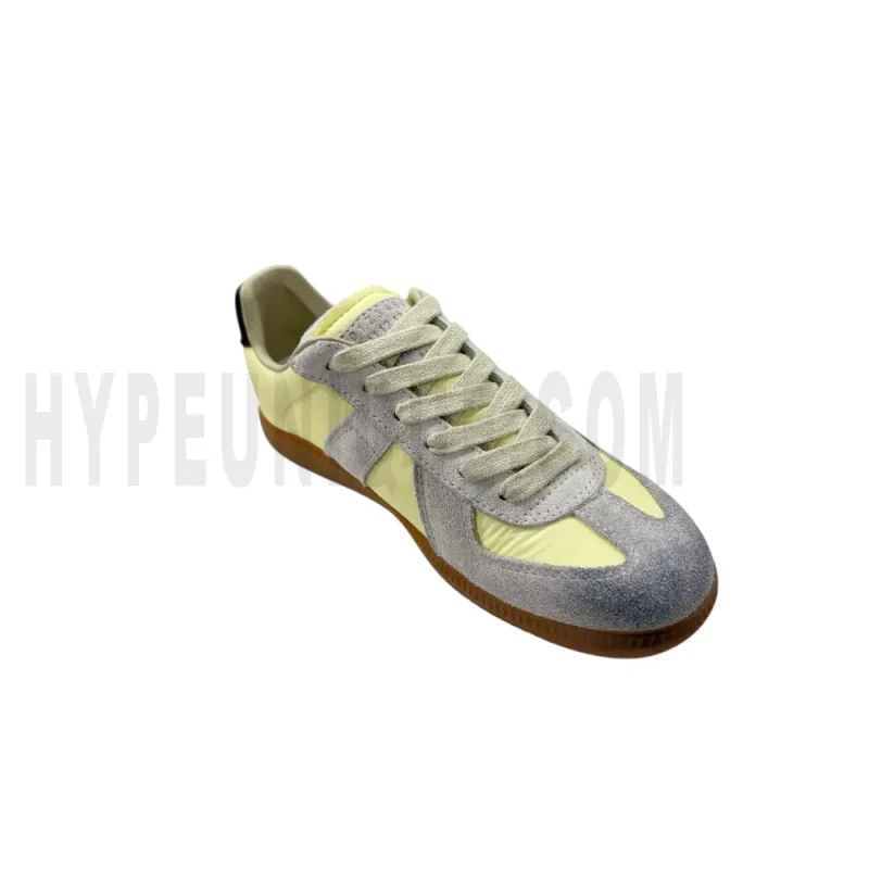 The left of the yellow shoes