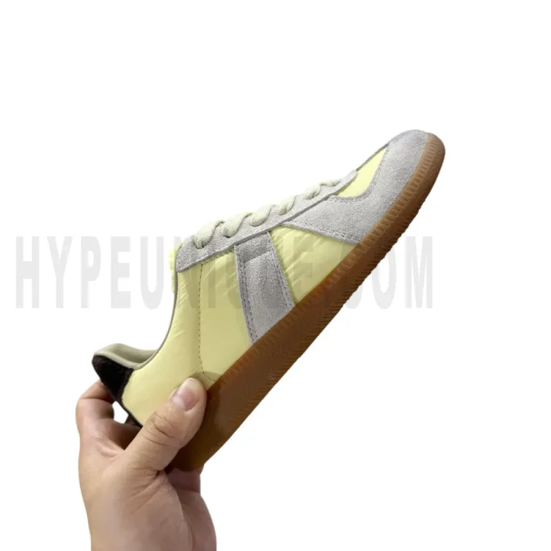 The right side of the yellow shoes