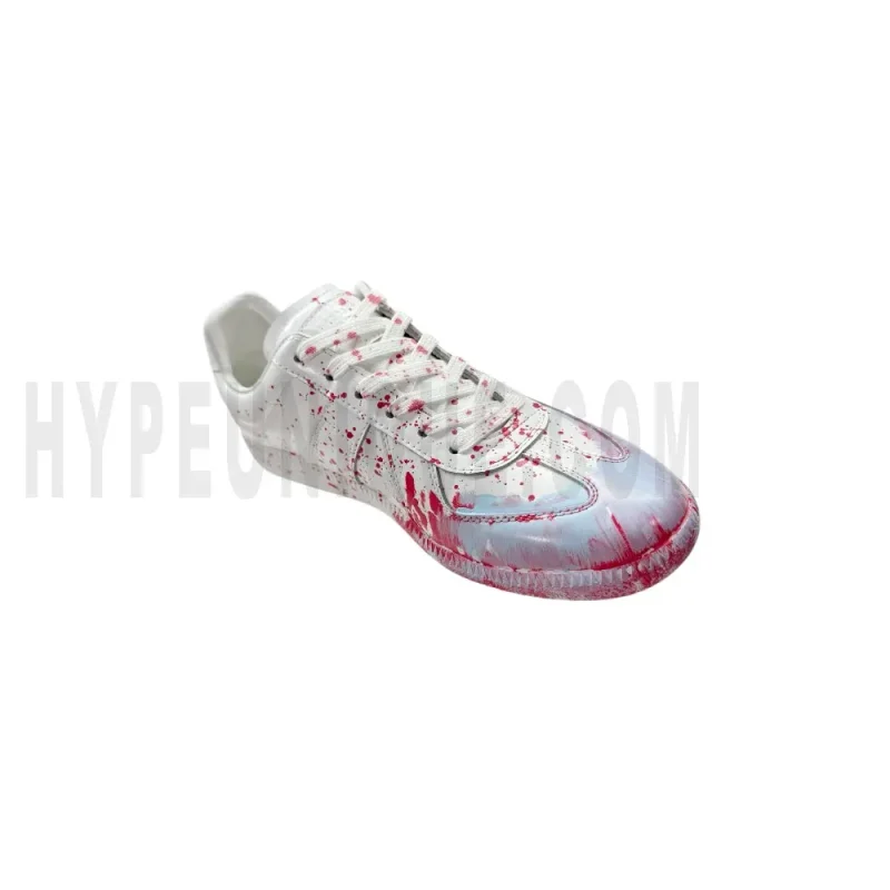 The left of the white shoes