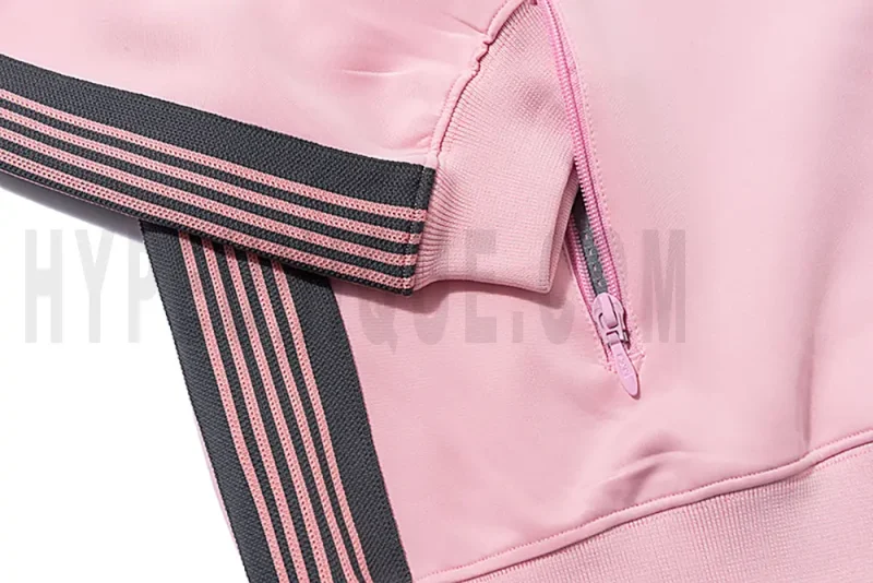 Close-up of sleeve stripe detail on the jacket.