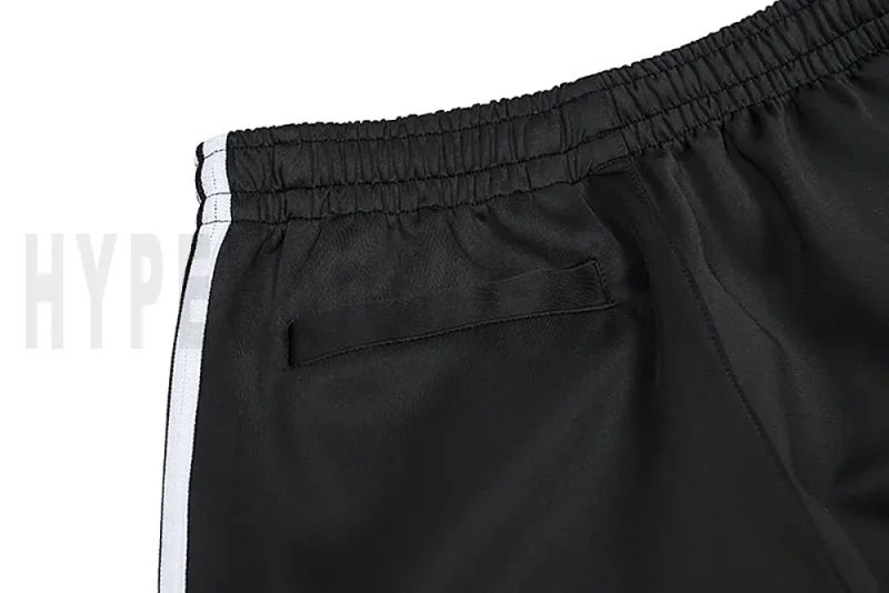 Detail of the back pocket on the track pants.
