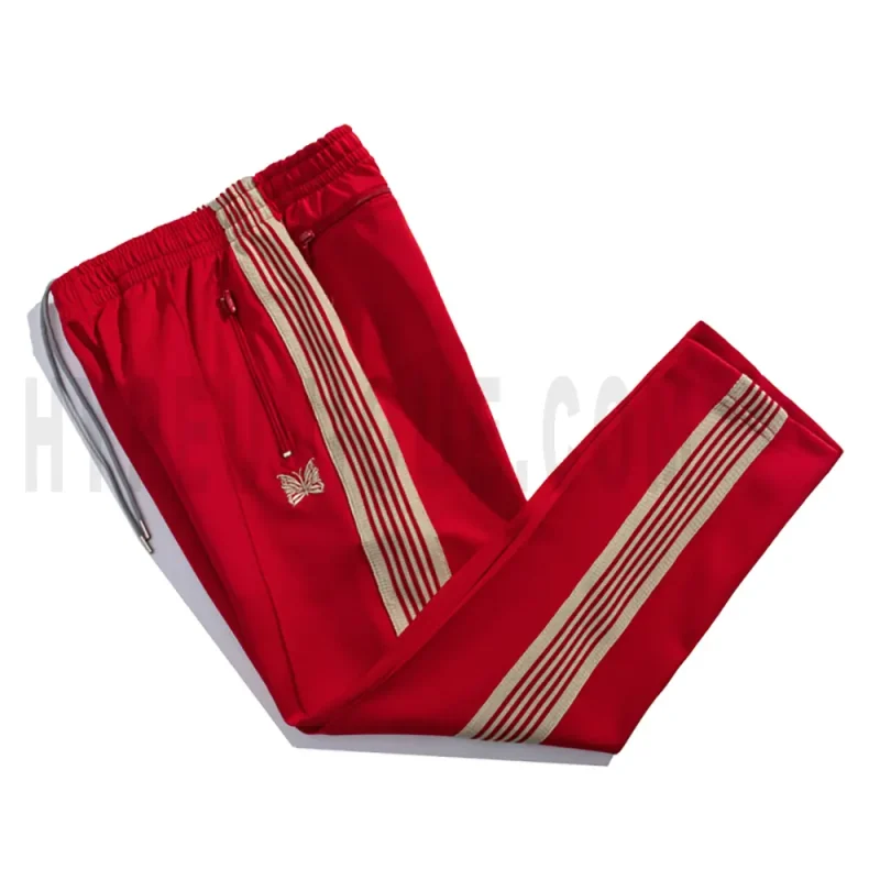 Side view of red track pants.