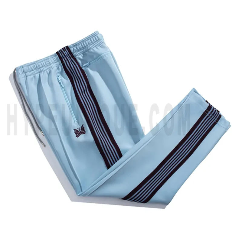 Side view of blue track pants.
