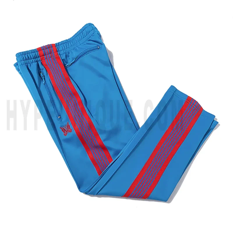 Side view of blue track pants