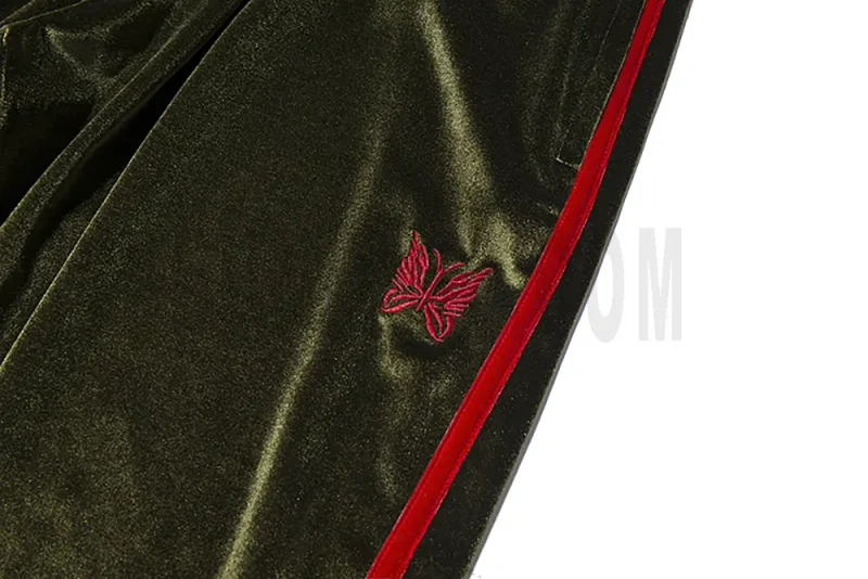 Exquisite red butterfly embroidery on a green base.