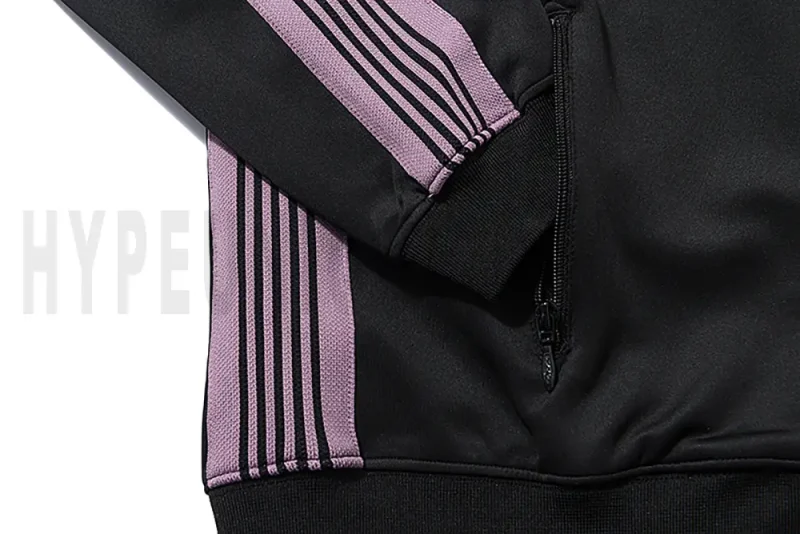 Close-up of sleeve stripe detail on the jacket.