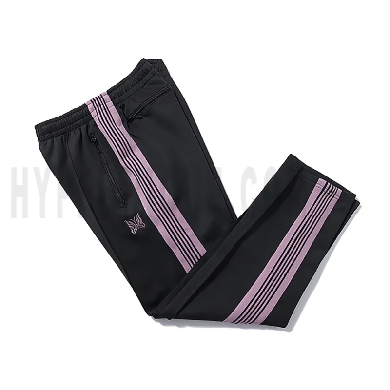 Side view of black track pants