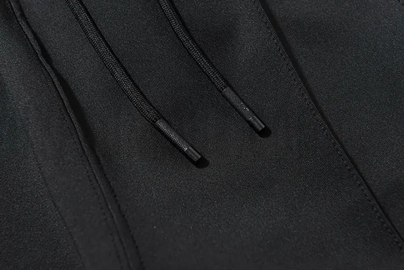 Adjustable webbing belt at the waist for a customizable fit.