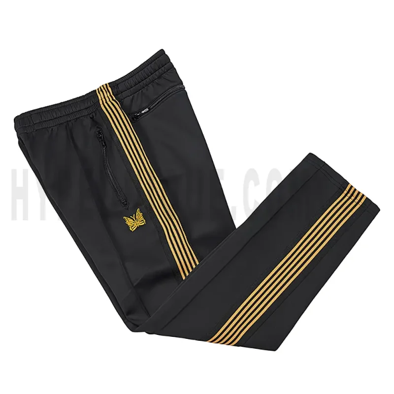 Side view of black track pants.