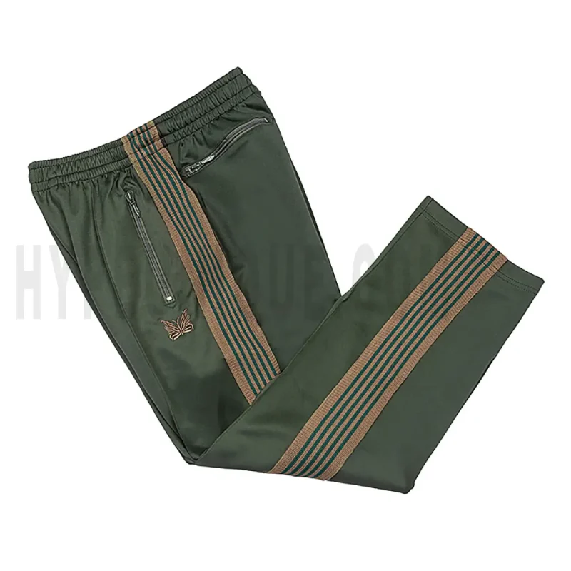 Side view of green track pants.
