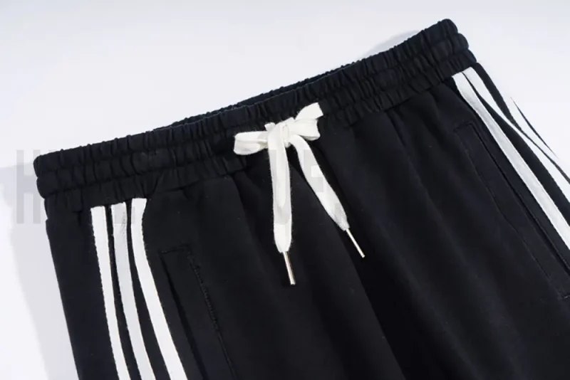 Adjustable webbing belt at the waist for a customizable fit.