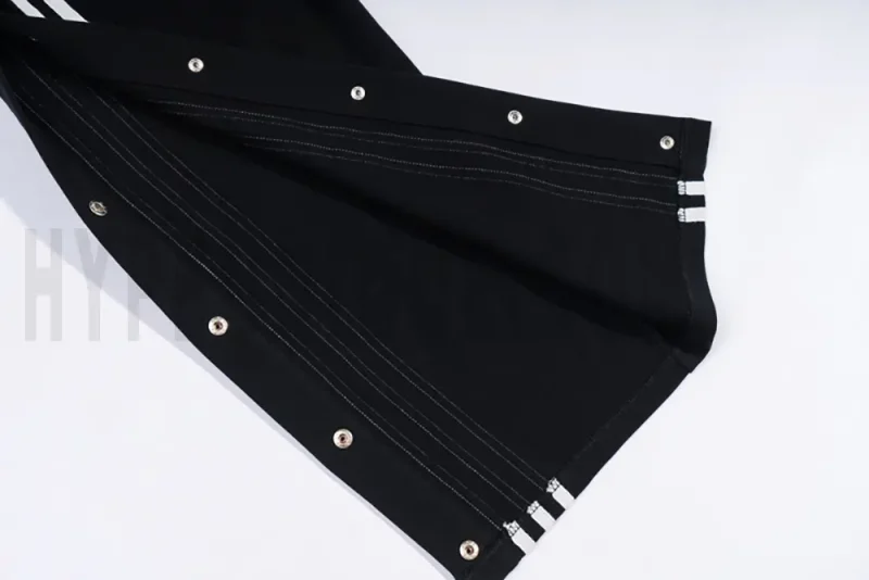 Snap-button pant legs of the black pants
