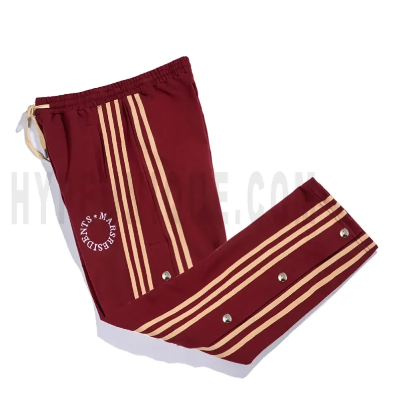 Side view of red track pants