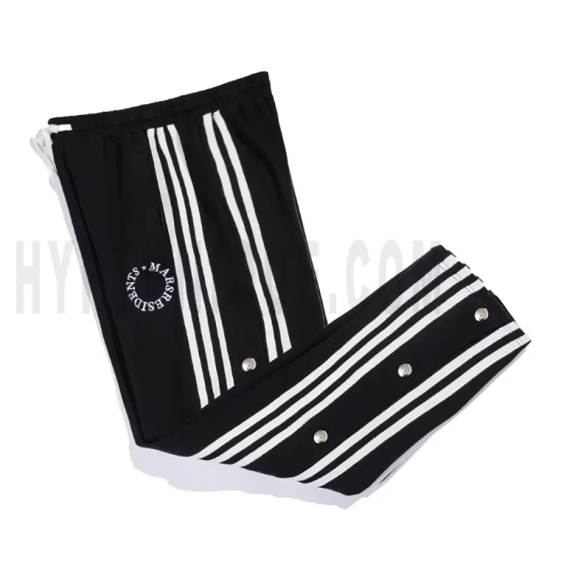 Side view of black track pants