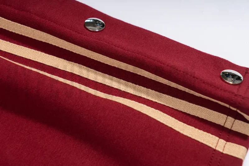 Side detail view of the red pants