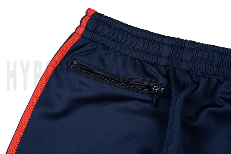 Detail of the back zip pocket on the track pants.
