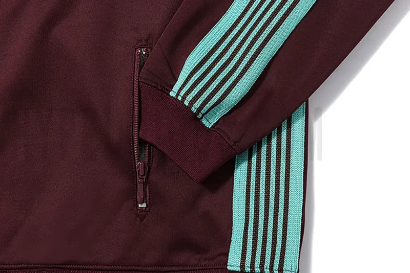 Close-up of sleeve stripe detail on the jacket.
