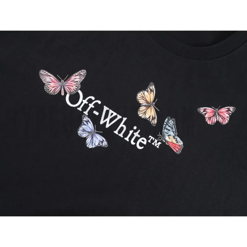 Detailed shot capturing the graphic print on the black tee's front panel.