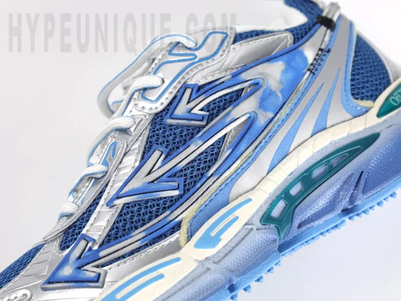 Mesh and logo on the outside of the shoe