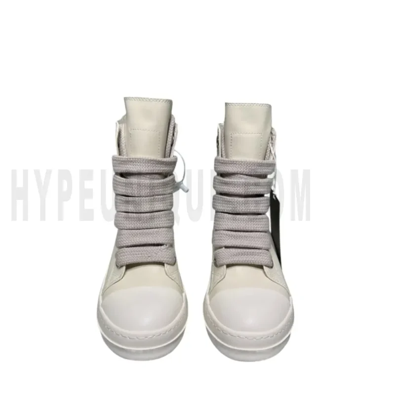 The front of the beige shoes