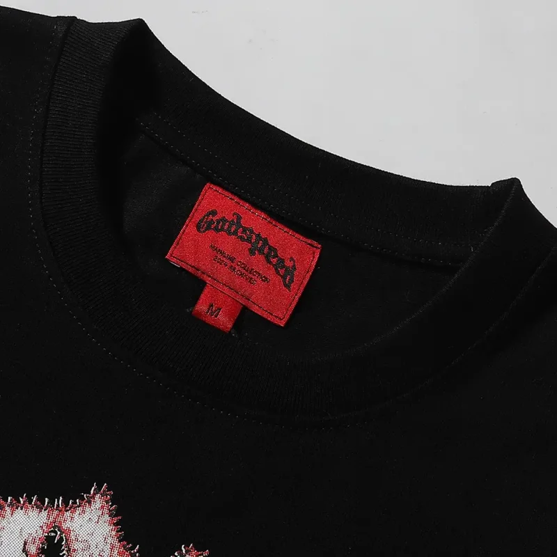 Clean hemline finish with a modern cut, highlighting the T-shirt's streetwear aesthetic.