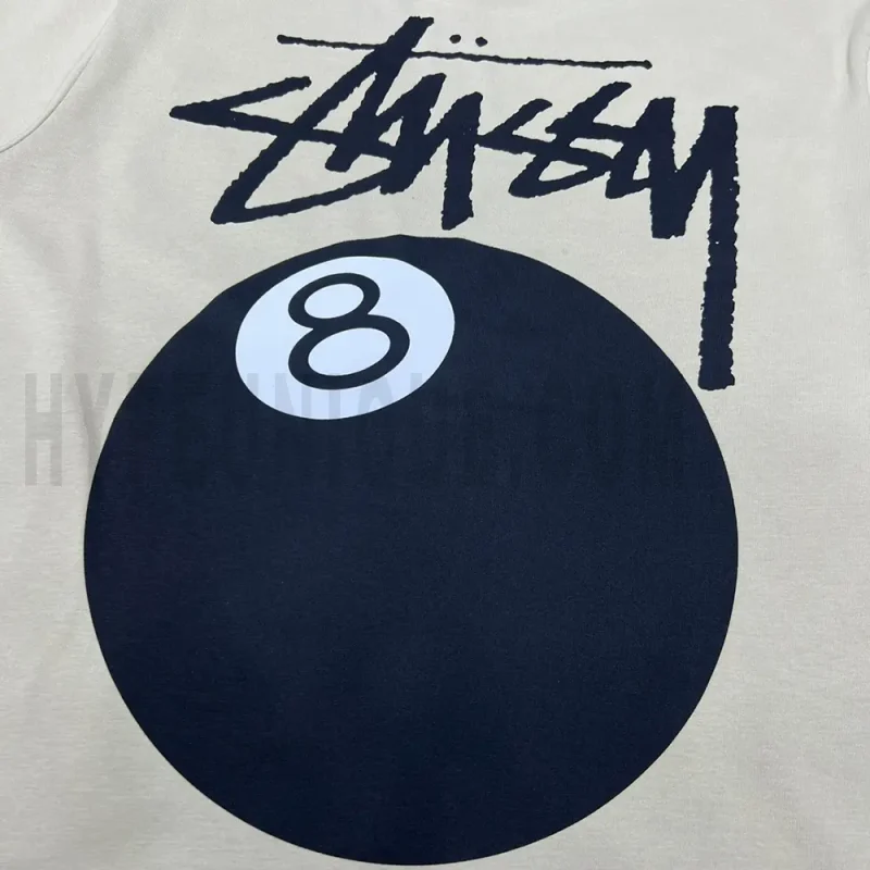 Close-up of the T-shirt print details of the back of the beige clothes.