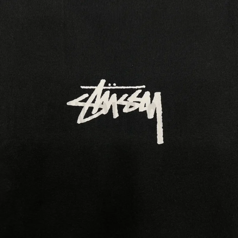 Close-up of the T-shirt print details of the front of the black clothes.
