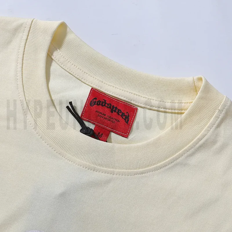 Close-up of the T-shirt's neckline tag, showcasing wash care instructions and brand details in a fashion design.