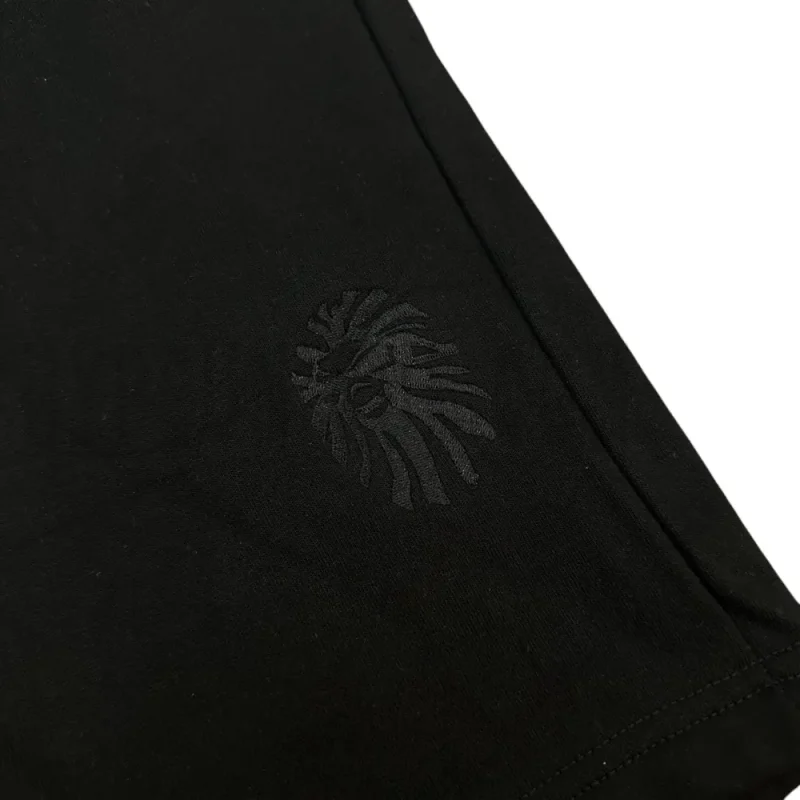 Embroidered graphic on the front of the shorts