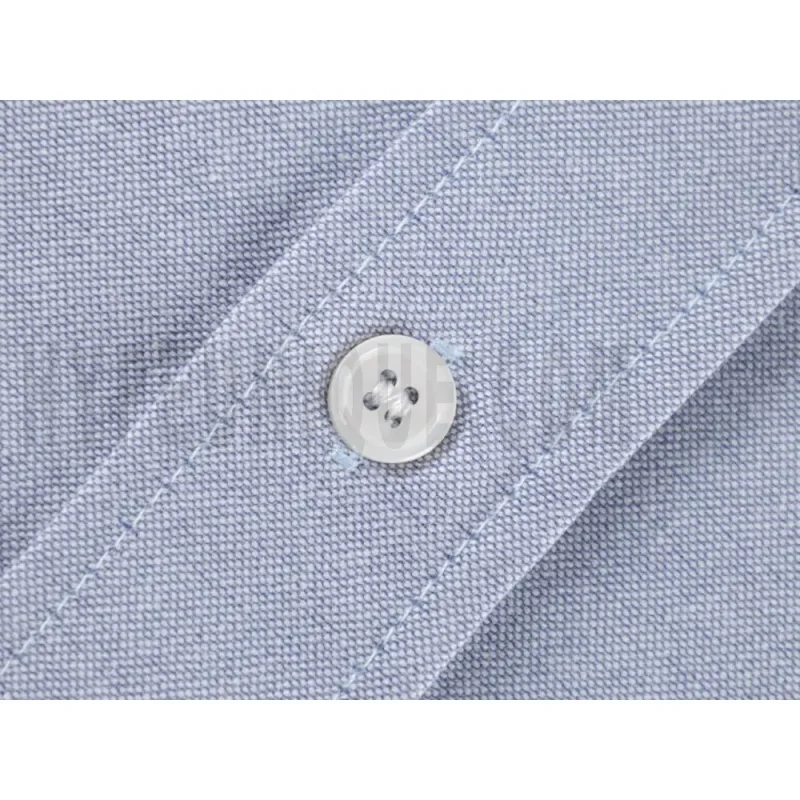 Close-up of button detail on the garment