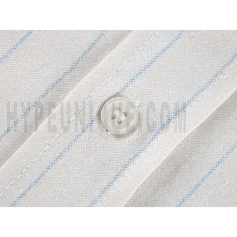 Close-up of button detail on the garment