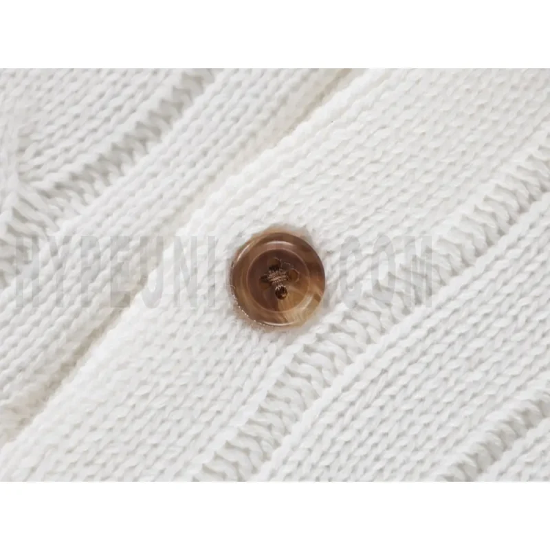 Close-up of button detail on the garment