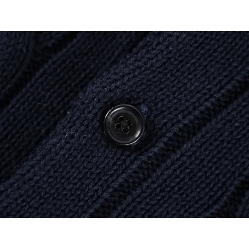 Close-up of button detail on the garment