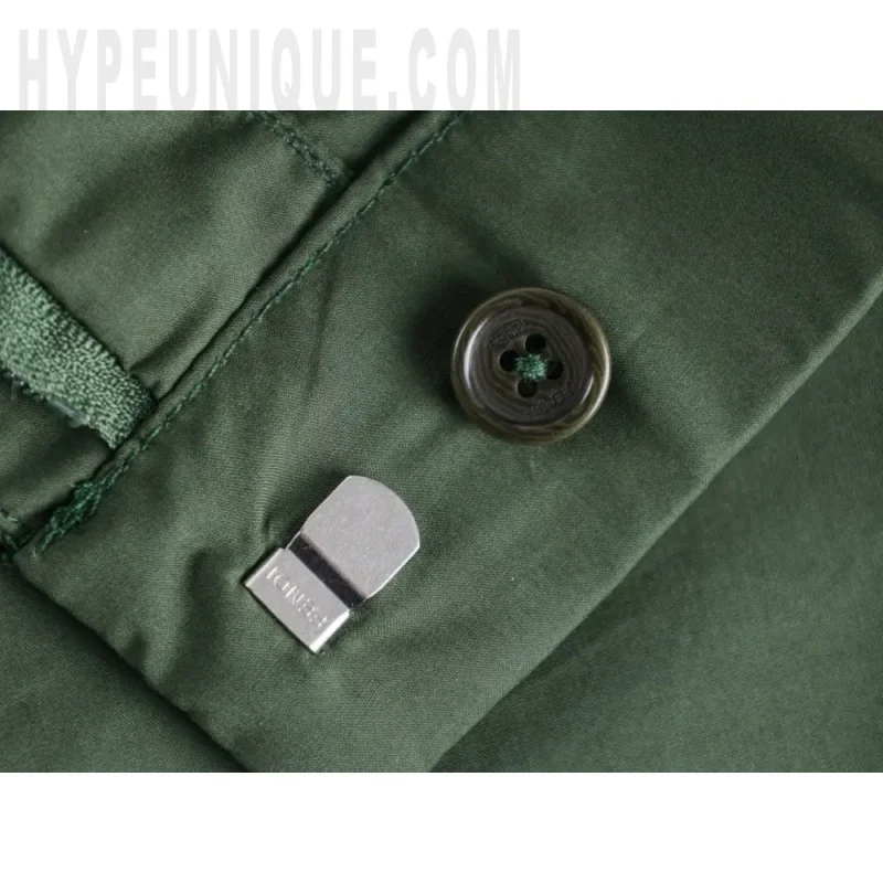 Close-up of button detail on the shorts