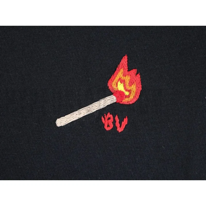 Embroidered graphic on the side of the T-shirt