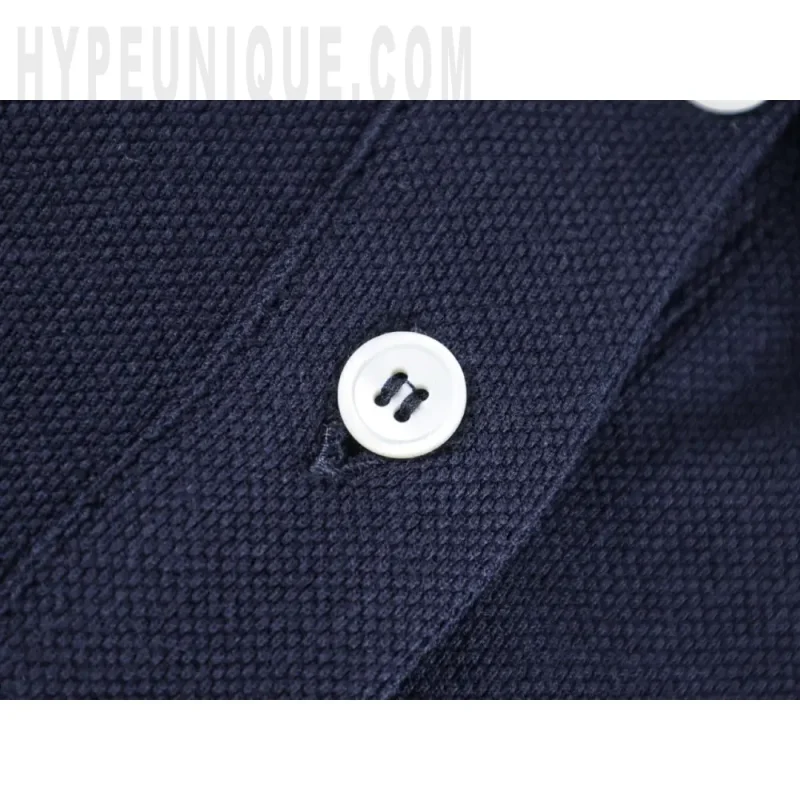 Close-up of button detail on the clothes