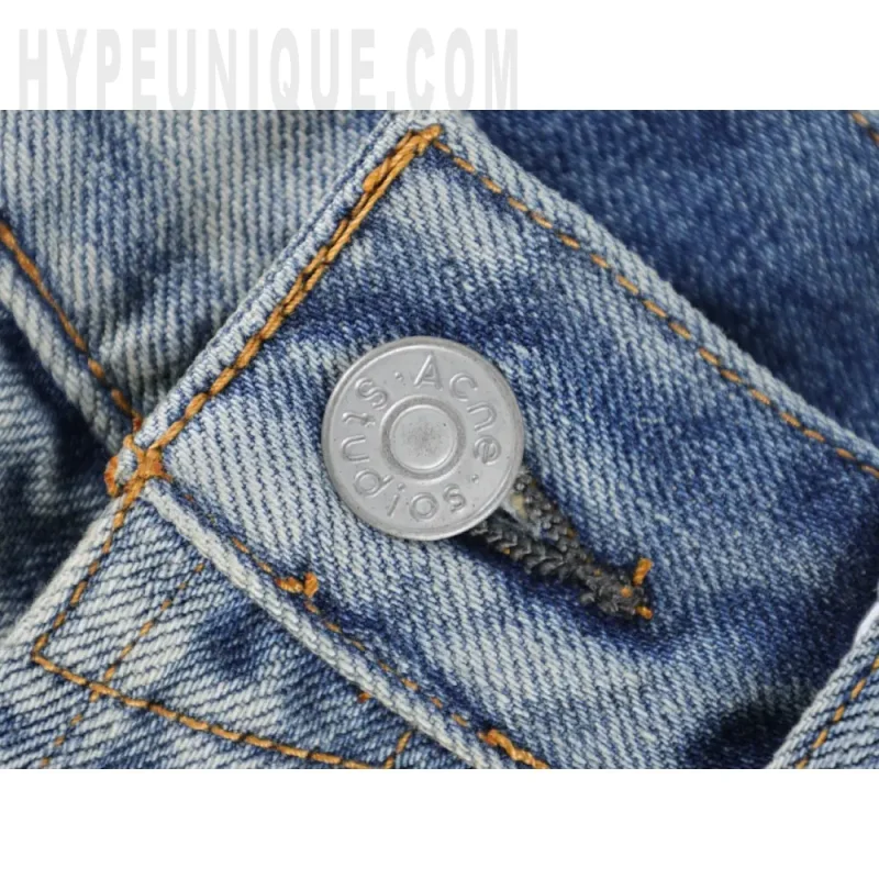 Close-up of button detail on the pants