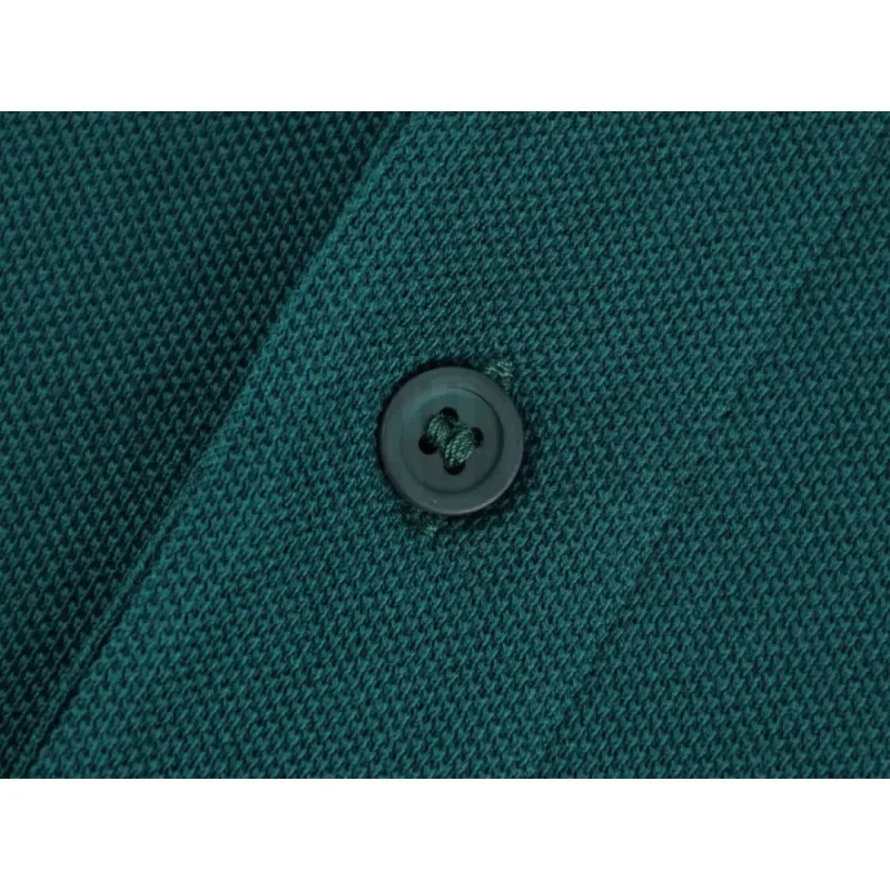 Close-up of button detail on the garment