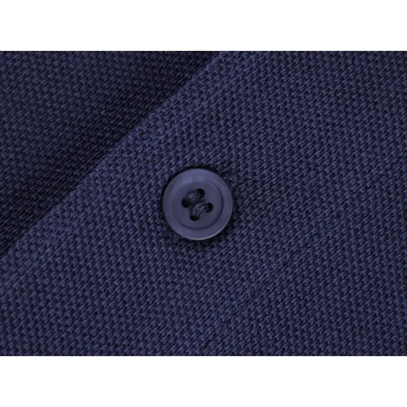 Close-up of button detail on the garment