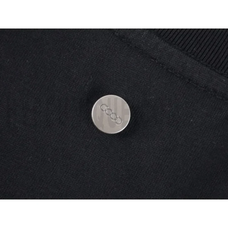 Close-up of button detail on the garment