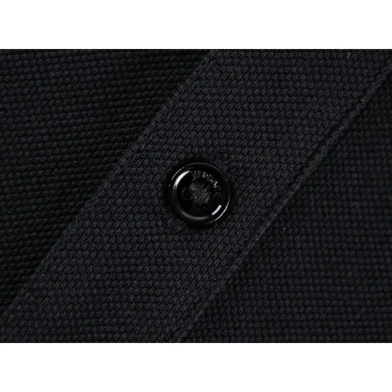 Close-up of button detail on the garment