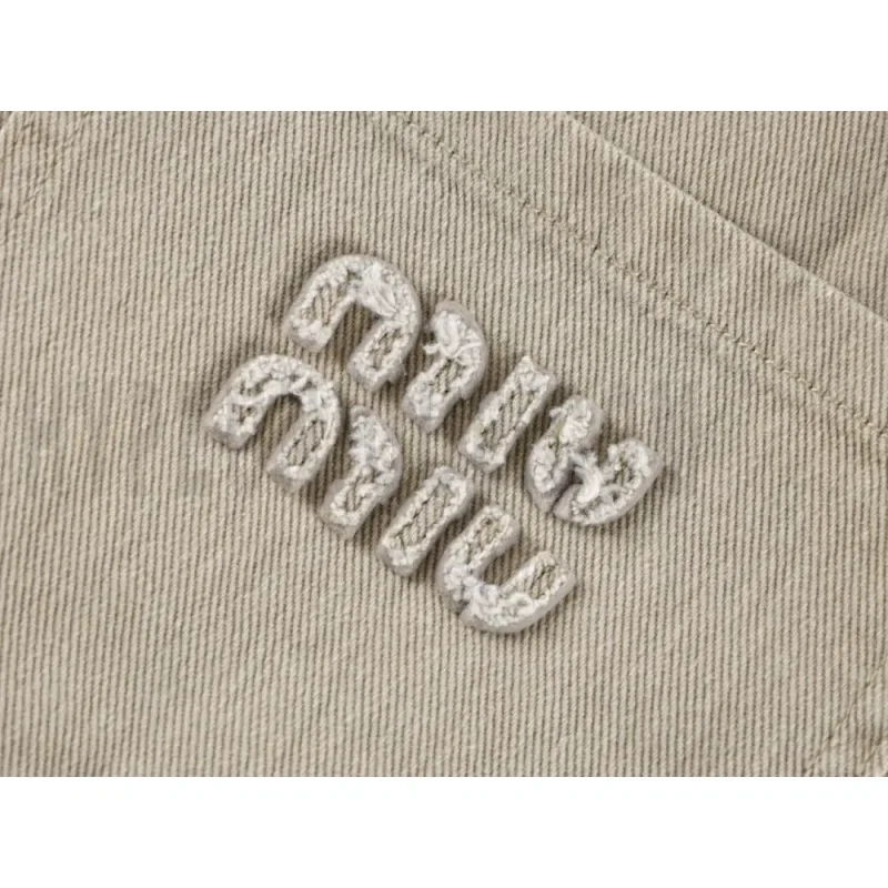 Embroidered graphic on the front of the pants