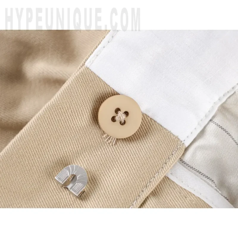 Close-up of button detail on the shorts