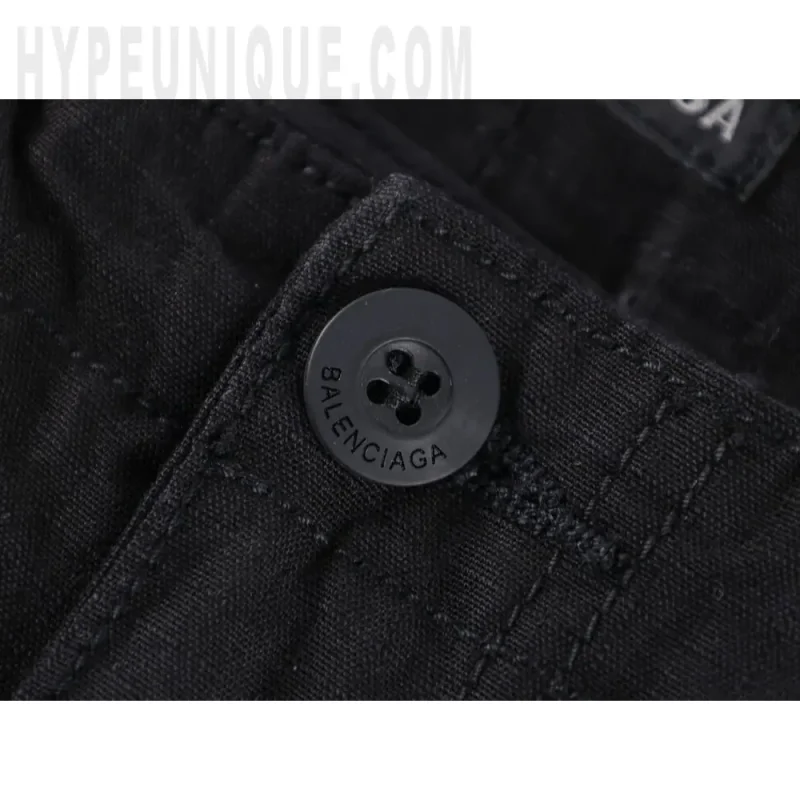 Close-up of button detail on the pants