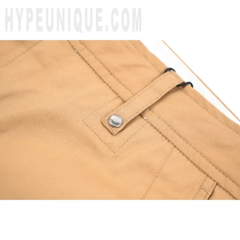 Close-up of button detail on the clothes